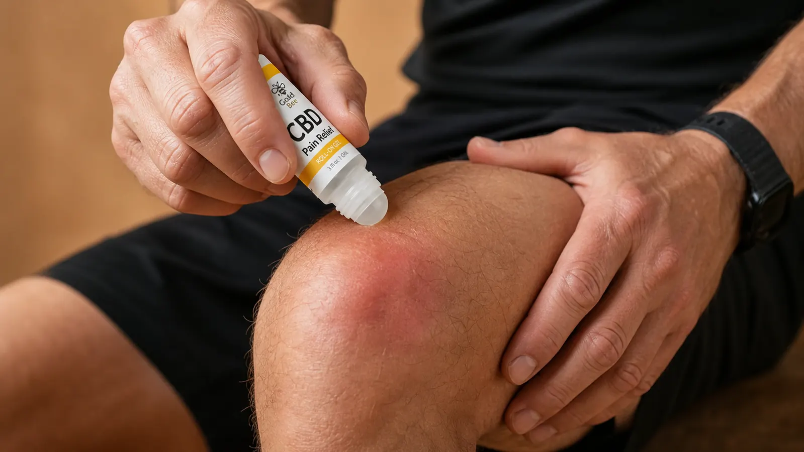 Runner sitting on a park bench applying roll-on topical gel to their calf immediately after a long run